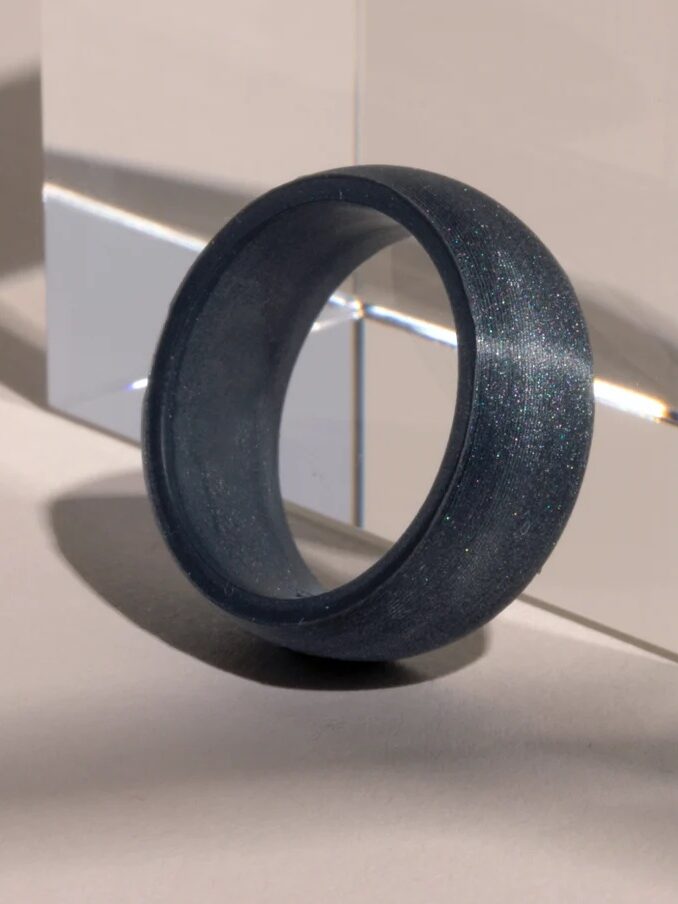 A closeup of a black silicone ring.